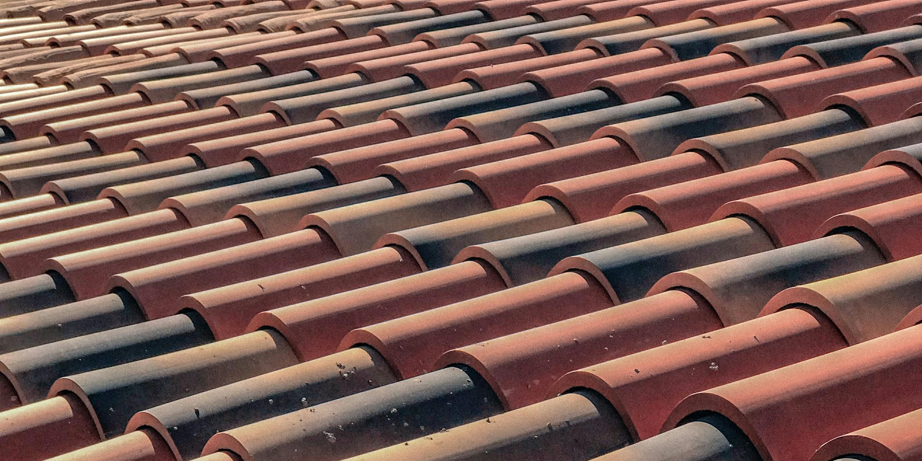 Clay roof tiles on a Mediterranean-style home, offering fire resistance and a classic look.