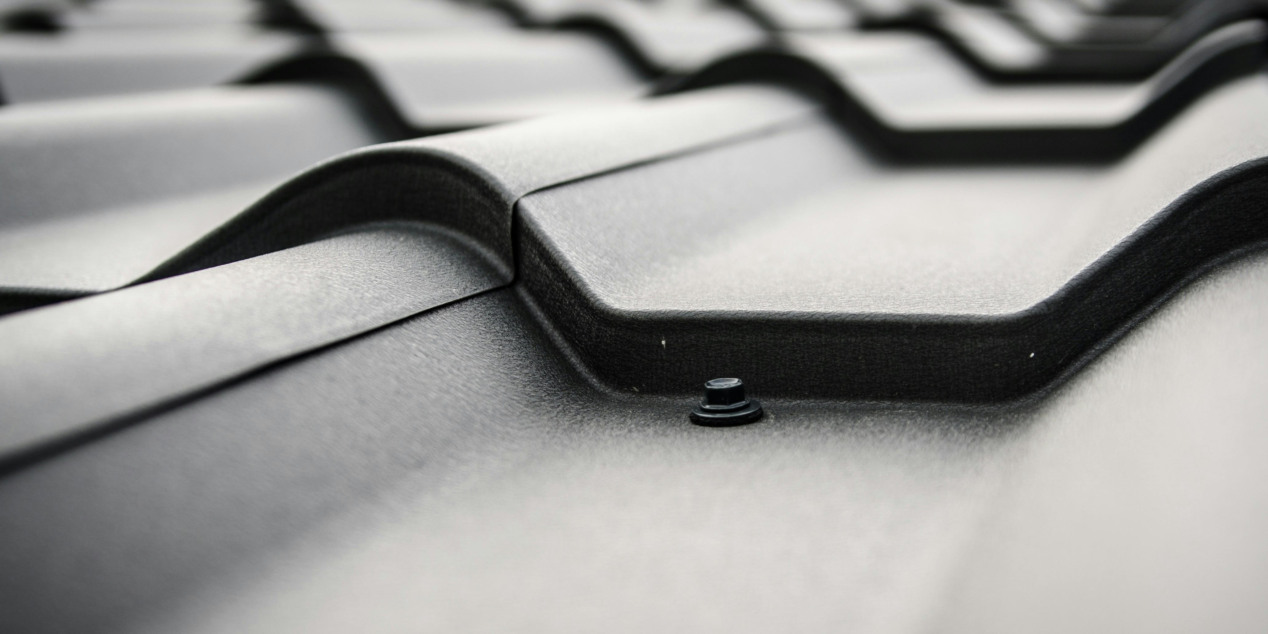 Durable metal roofing panels installed on a modern home, ideal for weather resistance.